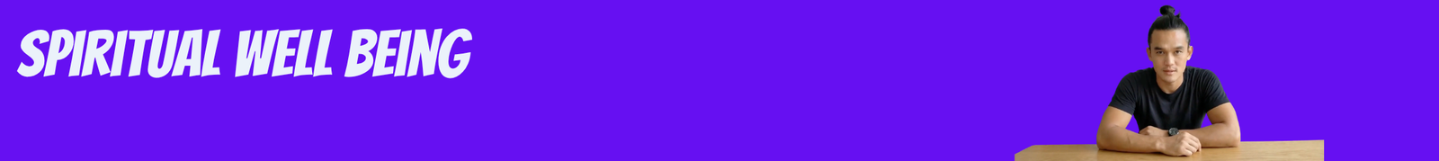 Bright Purple Banner with the Words 'spiritual Well Being' in Bold White Letters on the Left a Man with a Topknot Sits at a Wooden Desk on the Right Arms Resting on the Table